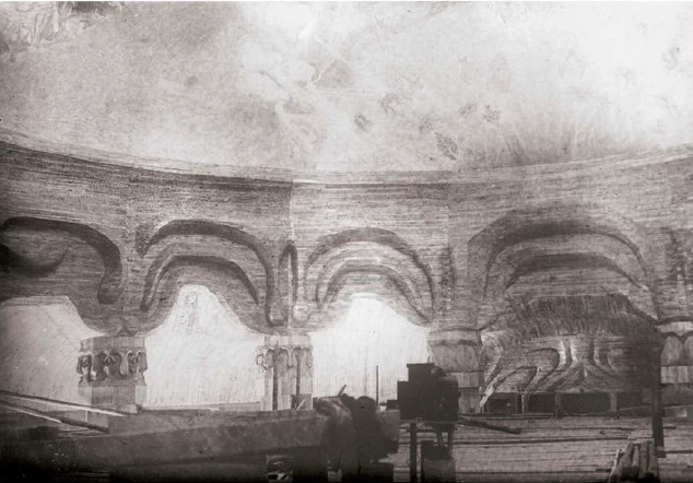 The large domed room of the first Goetheanum during construction. Architrave and capitals of the first two columns above the entrance, followed by the second to sixth columns on the left